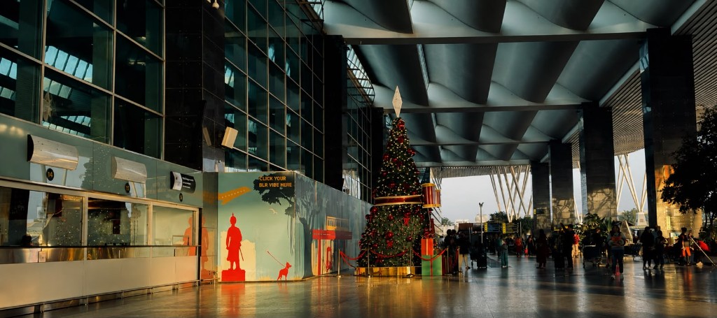 Terminal interior — wave ceiling, glass facade, late light